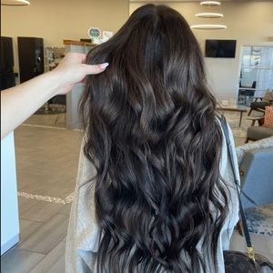 100% human hair extensions in the color black 24 inches
